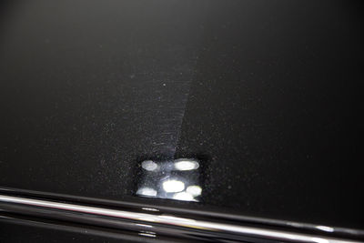 Close-up of illuminated car window