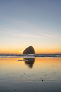 Scenic view of sea against sky during sunset