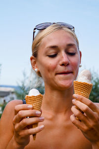 Woman looking at ice cream cone