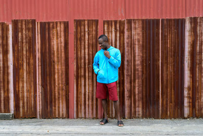 Full length of a man holding umbrella