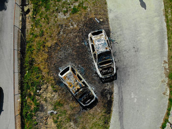 High angle view of abandoned car on road