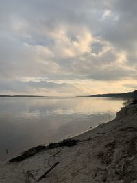 Scenic view of beach against sky during sunset