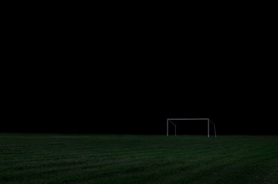 Scenic view of soccer field at night