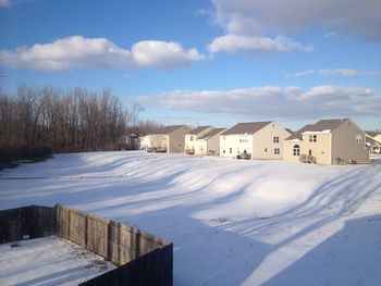 Houses on snow covered landscape