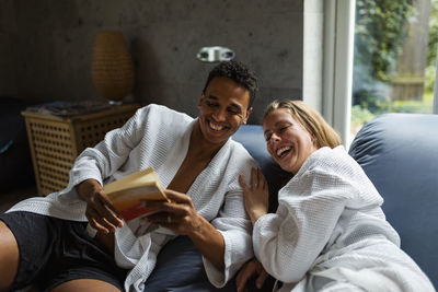 Couple relaxing together in living room