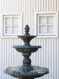 Close-up of fountain against building