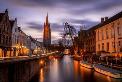 Canal passing through city buildings