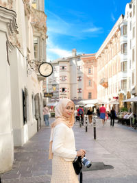 Portrait of muslim girl in hijab and jubah dress in outdoor scenes lifestyle and vacation concept