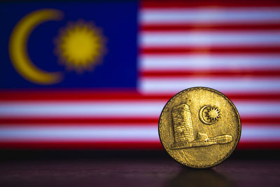 Close-up of coins against blurred background