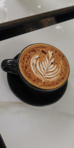 Close-up of cappuccino on table