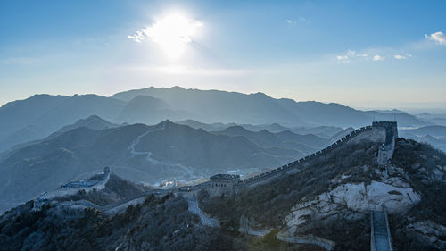 Scenic view of snowcapped mountains against sky during sunset