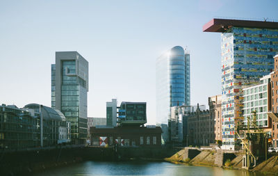 Skyscrapers in city against clear sky