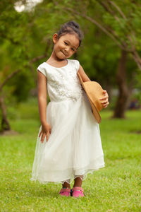 Happy girl standing on field