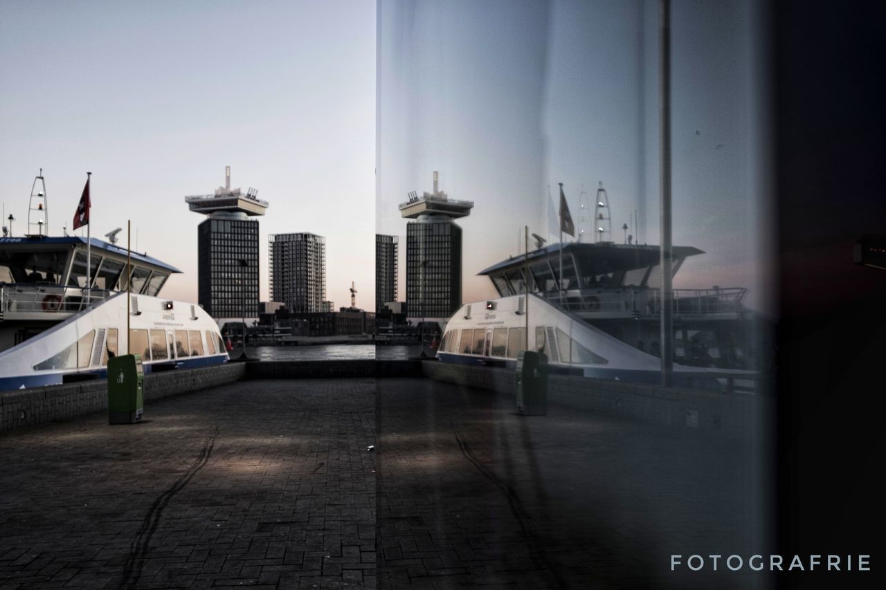 CITY BUILDINGS AGAINST SKY