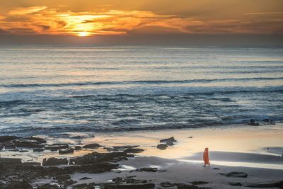 Scenic view of sea at sunset