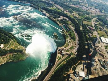 High angle view of river passing through city