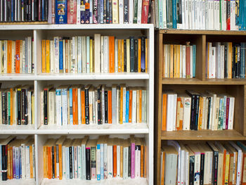 Books arranged on shelf at library