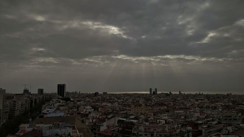 High angle view of buildings in city against sky