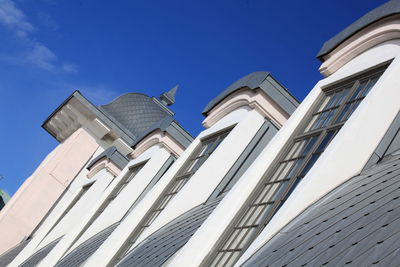 Low angle view of building against blue sky