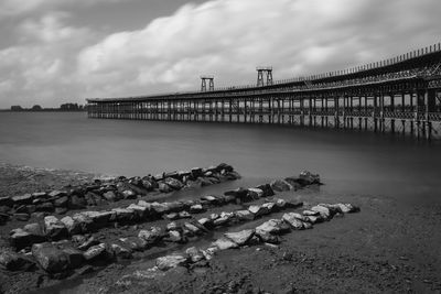 Bridge over sea against sky