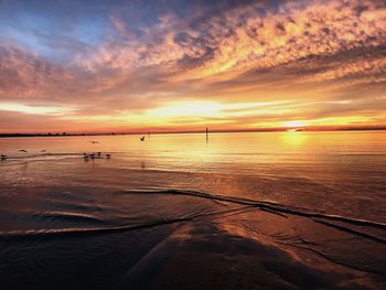 Scenic view of sea against sky during sunset