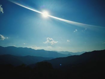 Scenic view of silhouette mountains against sky