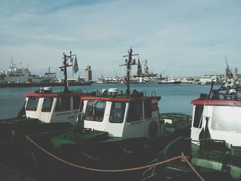 Boats moored at harbor