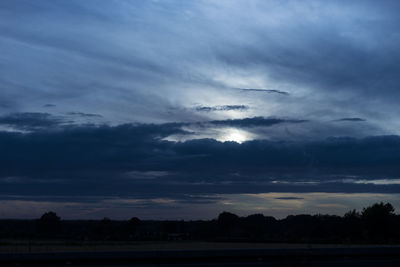 Scenic view of landscape against cloudy sky