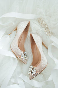 Close-up of bridal shoes dainty beautiful wedding high heels stilletos flatlay details