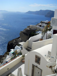 High angle view of buildings by sea