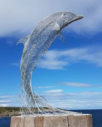 Tilt image of sea against blue sky