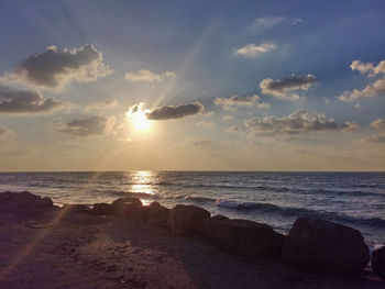 Scenic view of sea against sky during sunset