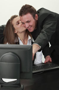 Young couple looking at camera