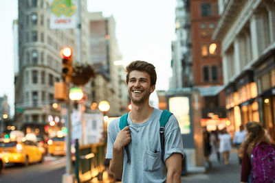 Portrait of smiling man on street in city