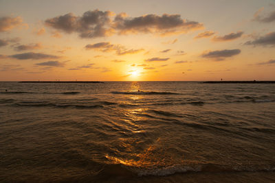 Scenic view of sea against sky during sunset