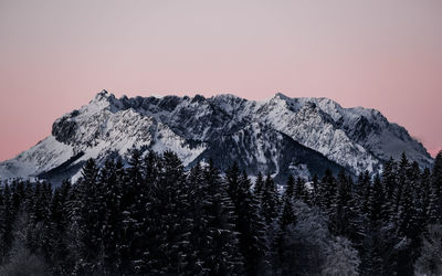 Scenic view of snowcapped mountains against clear sky