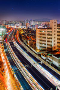 High angle view of illuminated cityscape at night