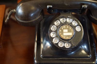 Close-up of telephone on table