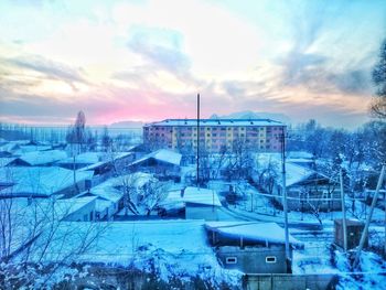 Panoramic view of buildings in city during winter