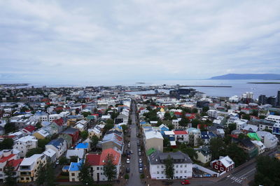 Cityscape against cloudy sky