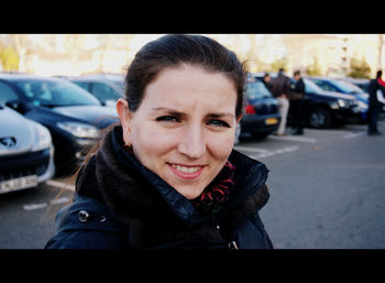 Portrait of smiling young woman in car