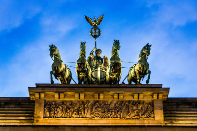 Low angle view of statue against sky