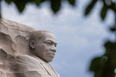 Low angle view of statue against sky