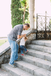 Side view of people on staircase