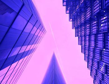 Low angle view of modern building against blue sky