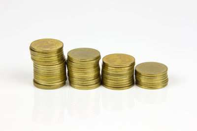 Close-up of coins on white background