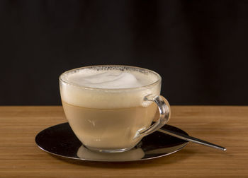 Close-up of coffee cup on table