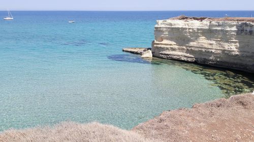 Scenic view of sea against blue sky