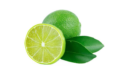 Close-up of lemon slice against white background