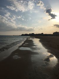 View of beach against sky during sunset